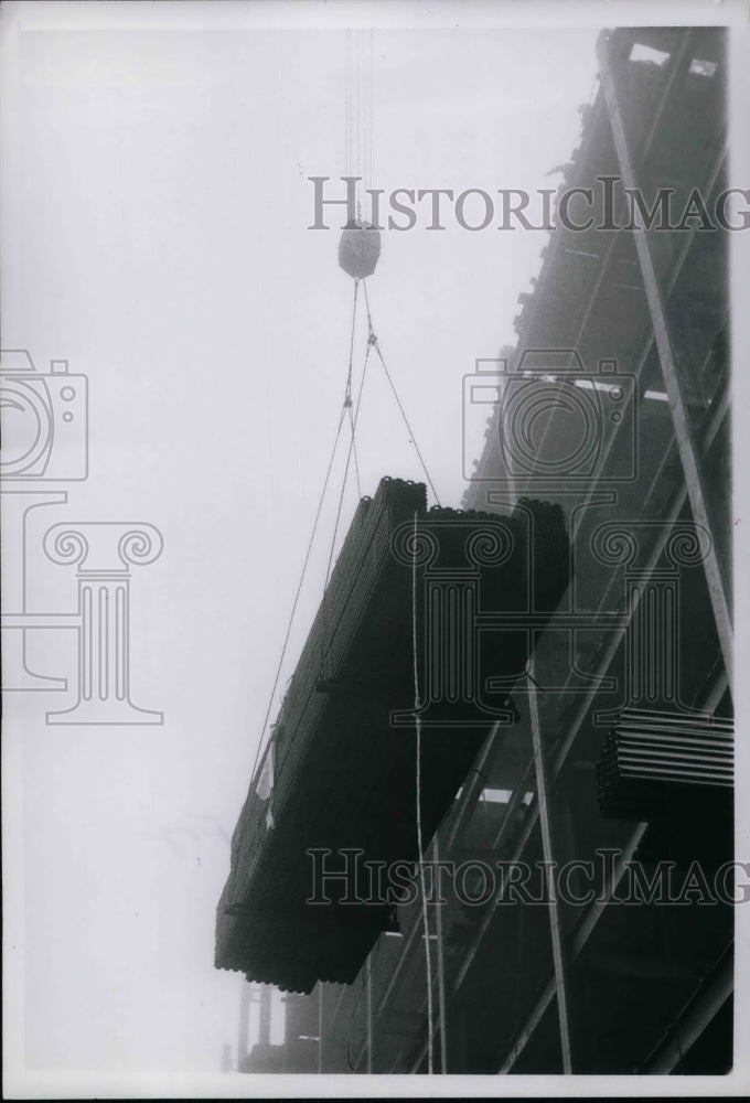 1965 Press Photo Tons of steel lifted up by a Crane. - nea66546 - Historic Images