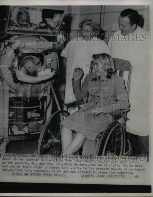 1951 Patricia DeMars waves goodbye to her brother Richard, 3 - Historic Images