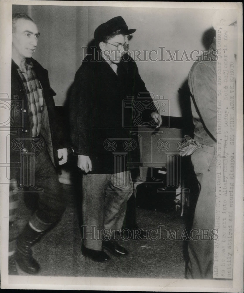 1947 Press Photo Man escorted by guards. - nea67193 - Historic Images