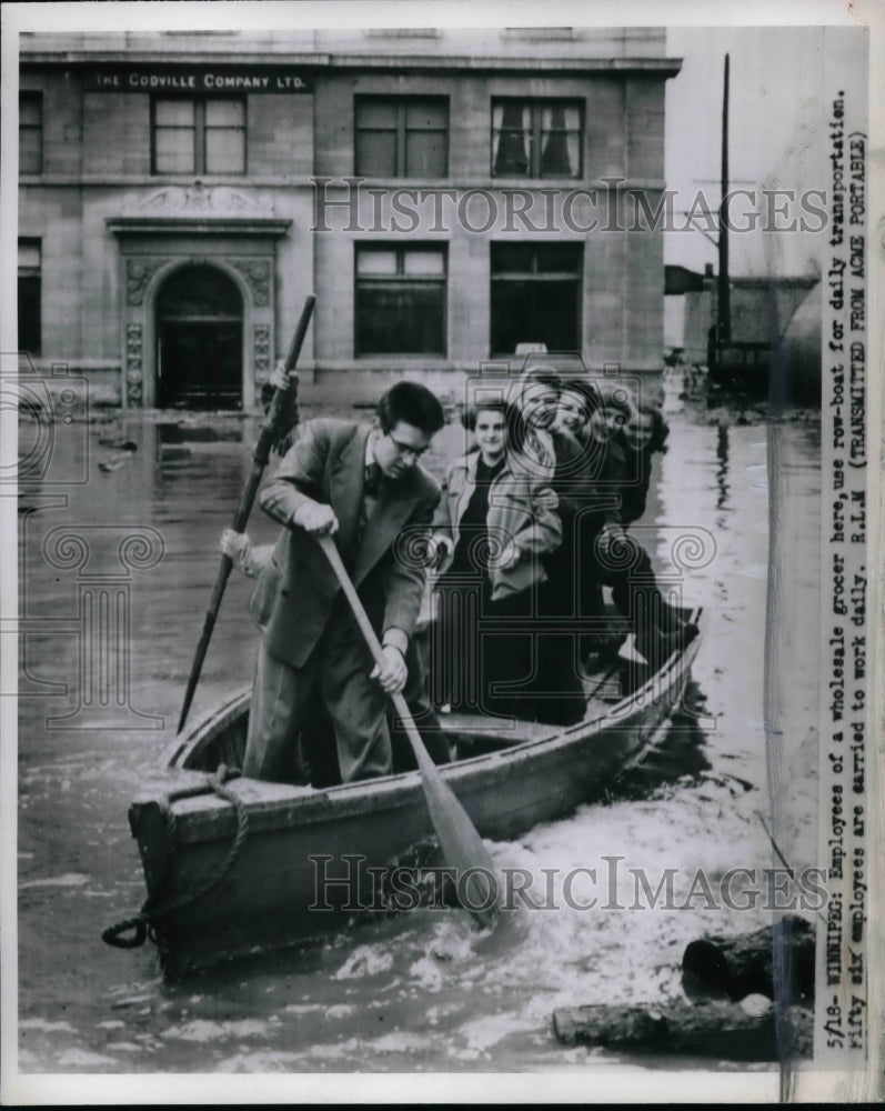 Employees of Grocery Store Boat Together to Wrok  - Historic Images