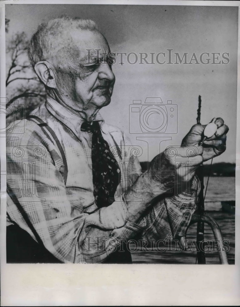 1950 Kaamazoo, Mich. Wm (Dad) Eddington, readies his fishing gear - Historic Images