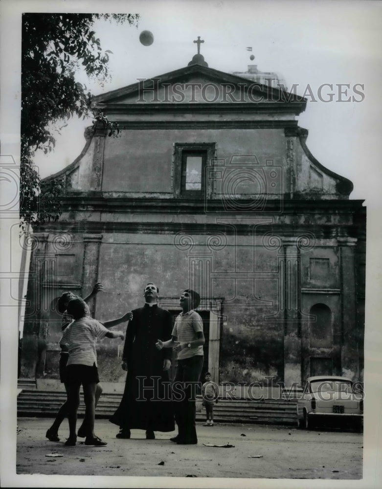 1962 Father Luigi Chirichilli Playing Ball at San Giovanni Battista - Historic Images