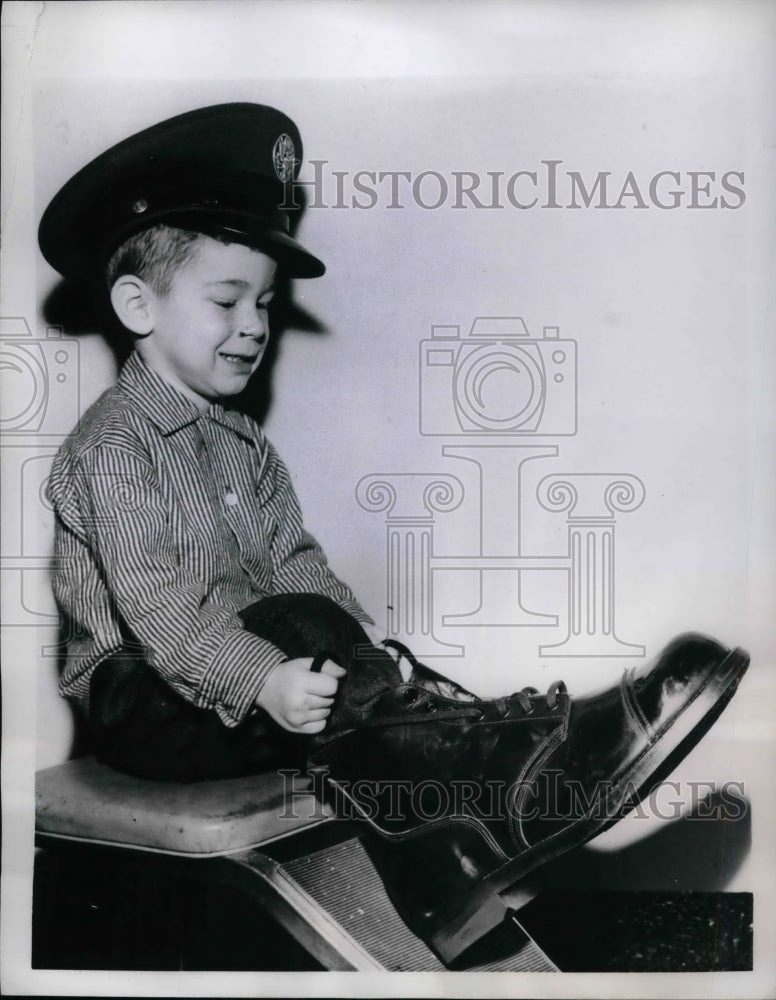1959 Chuck Redpenning Jr tries on dads boots  - Historic Images