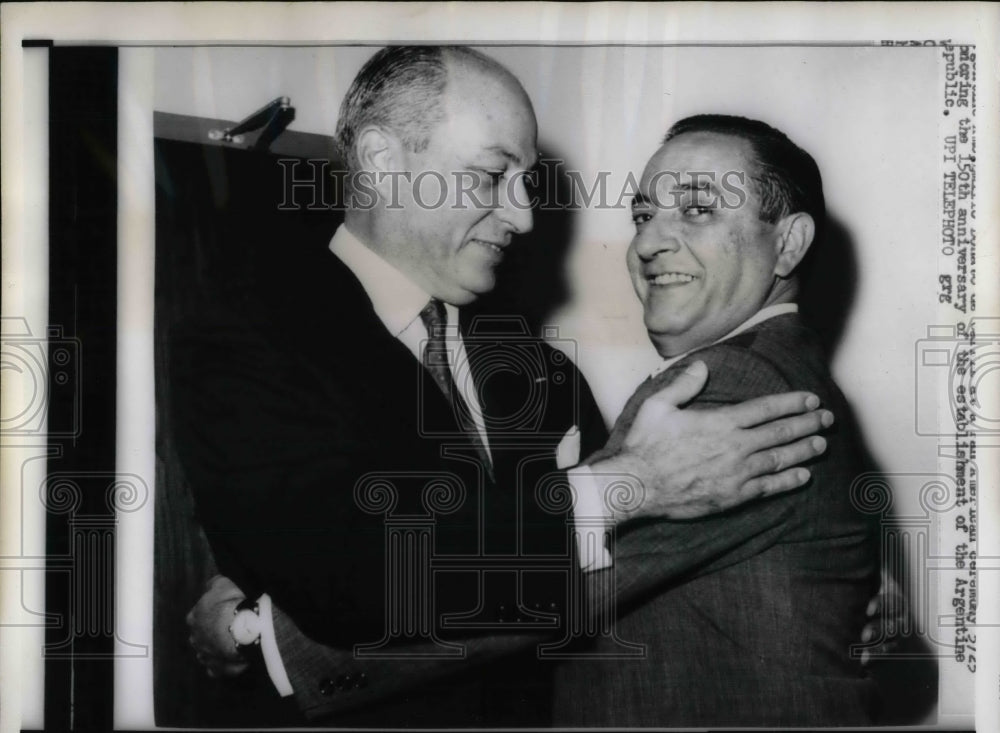 1960 Vincente Sanchez Gavito embraces Emilio Donato de Carril - Historic Images