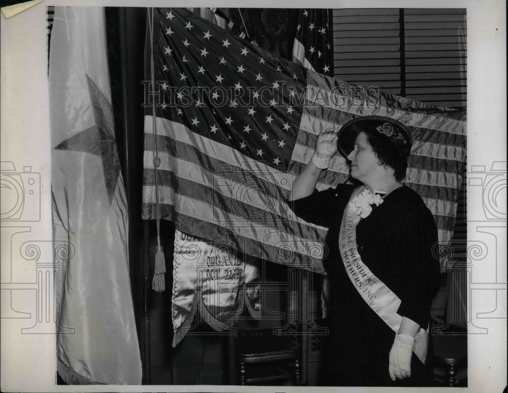 1938 Mrs. Bess Duncan Wells saluting the American flag  - Historic Images