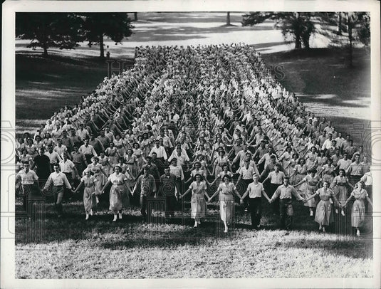 1953 Press Photo Men and Women walking holing hands. - nea68653 - Historic Images