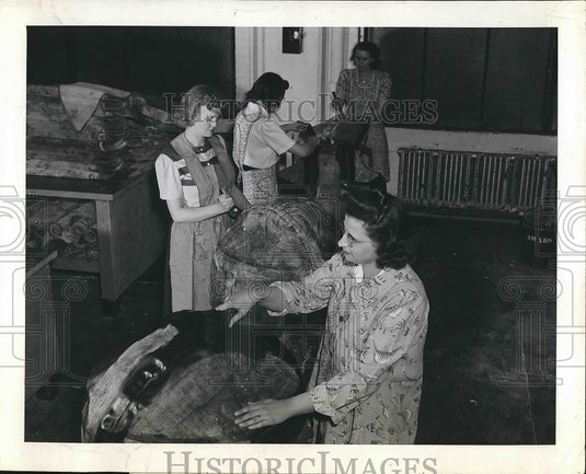 1948 Women make floats in a factory.  - Historic Images