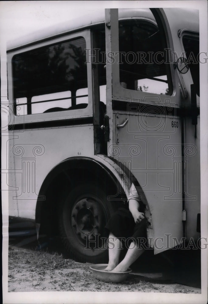 1953 Bus Operator takes a break in Berlin to beat the heat - Historic Images