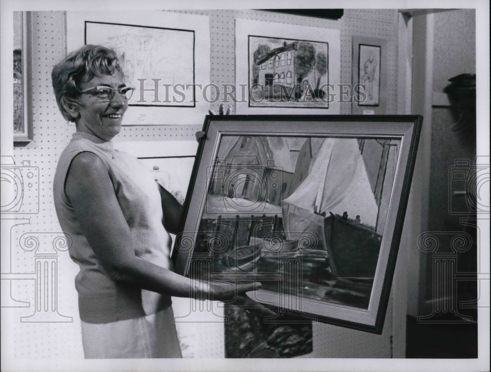 Mrs. Ray Hayden & one of her painting at Willoughby Fine Arts Show - Historic Images
