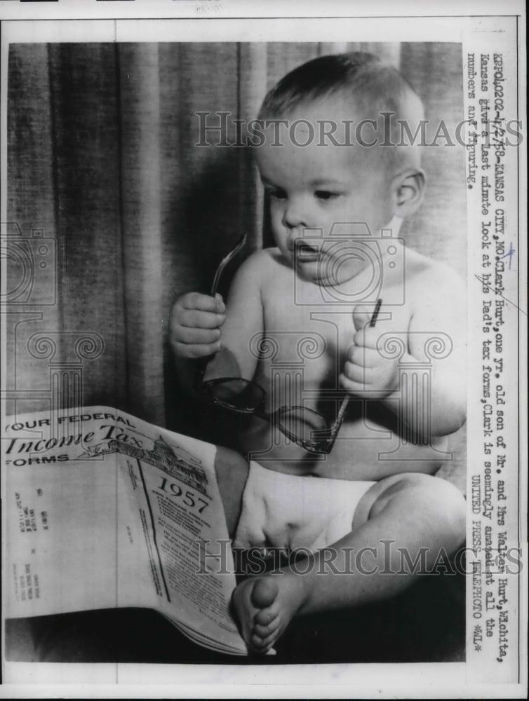 1958 Baby Clark Hurt pf Kansas City look at his Dad's tax Form. - Historic Images