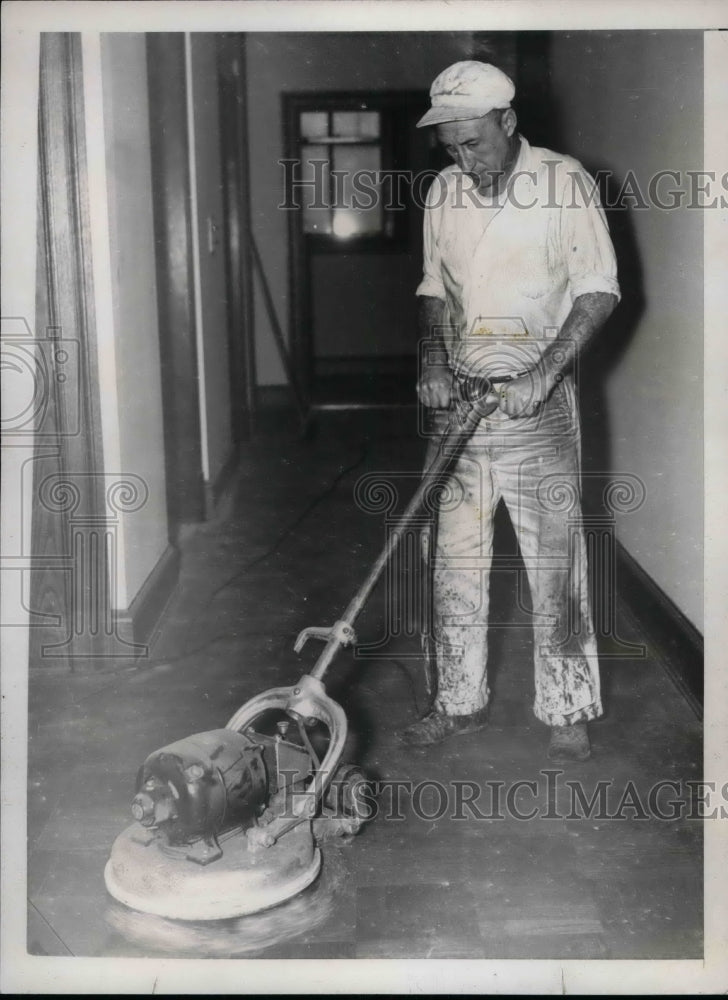 1937 Press Photo Workman polishes floor at HQ of United Mine workers in D.C. - Historic Images