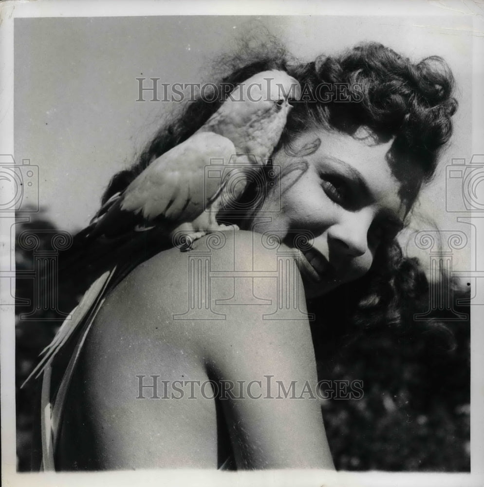 1949 Miami, Fla. model Ava Hall &amp; a golden parrot  - Historic Images