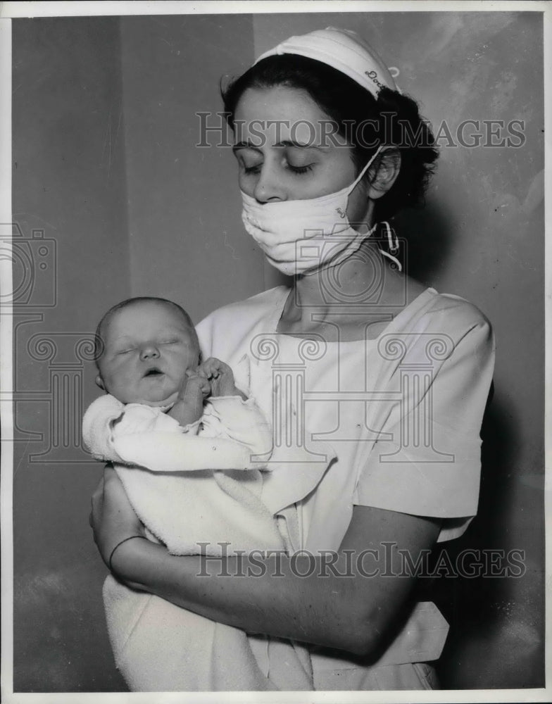1941 Nurse Geraldine Hurley in D.C. with baby C A heater  - Historic Images