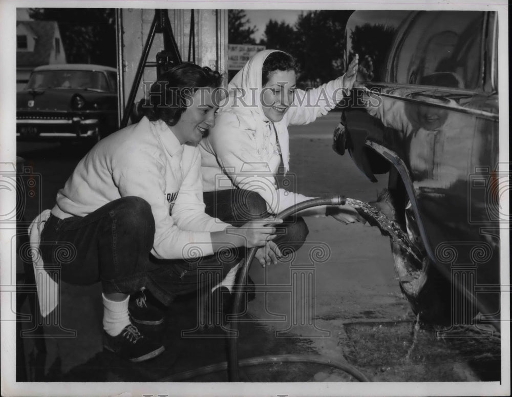 1957 Jo Anne venefra & Dolores Adams wash a car in Cleveland - Historic Images
