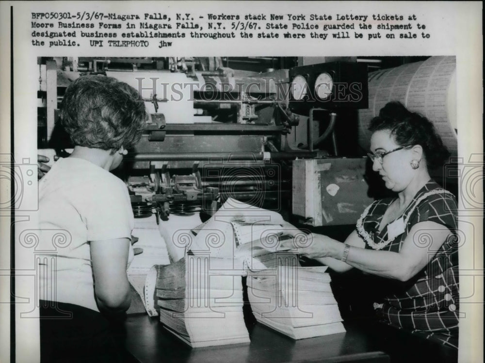 1967 Press Photo Workers stack New York State Lottery tickets at Moore Business - Historic Images