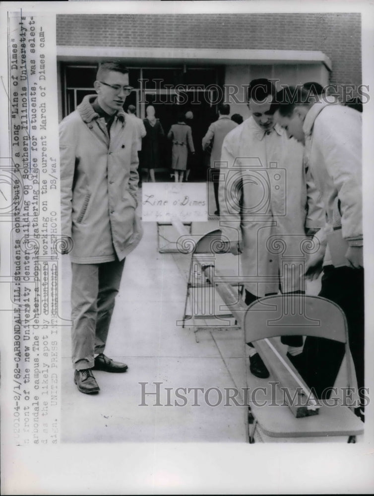1962 Students contribute to a long "Line of Dimes" in front of the - Historic Images