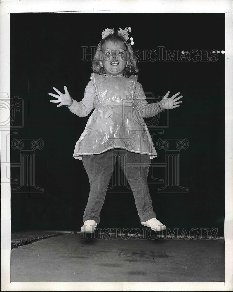 1947 little girl Nikki jumping on a trampoline  - Historic Images
