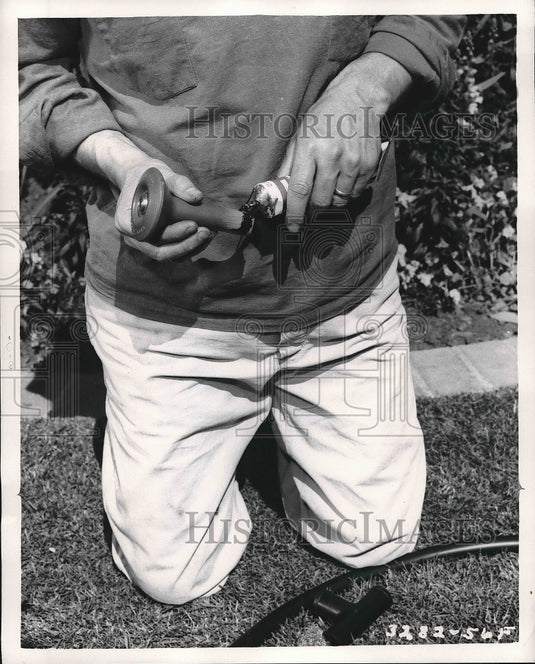 1944 Press Photo Person installing underground sprinkling system - nea71845 - Historic Images
