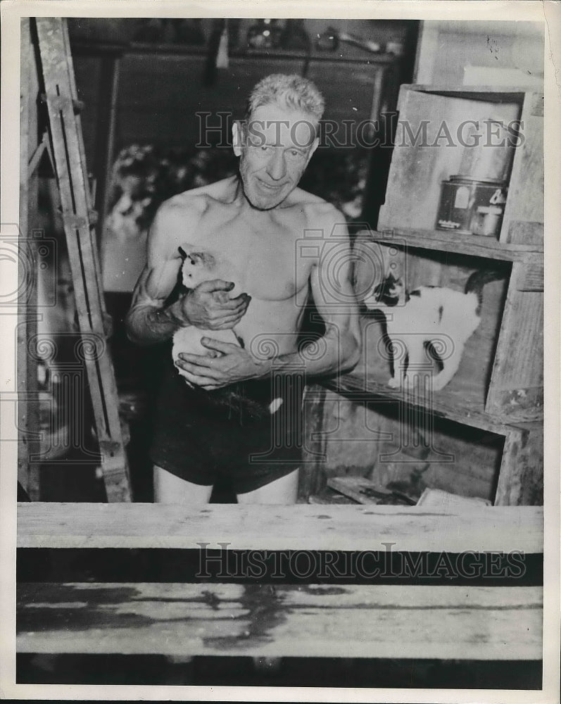 1951 George Laewig standing in his flooded home  - Historic Images