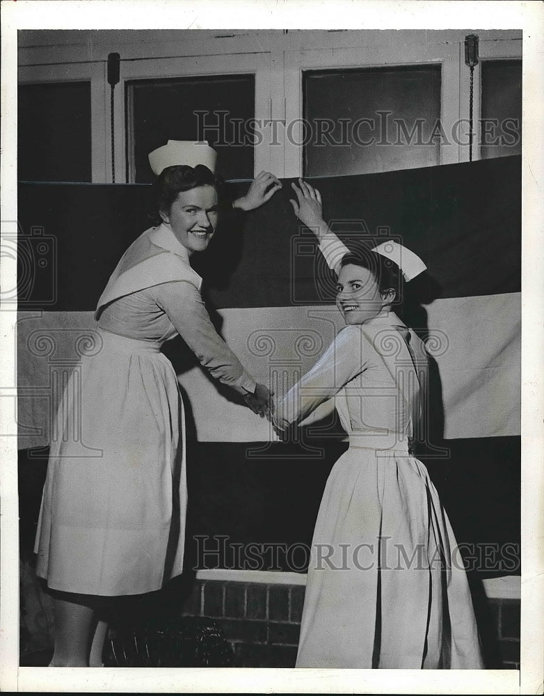 1943 Nurses of Civic Hospital hanging flag  - Historic Images