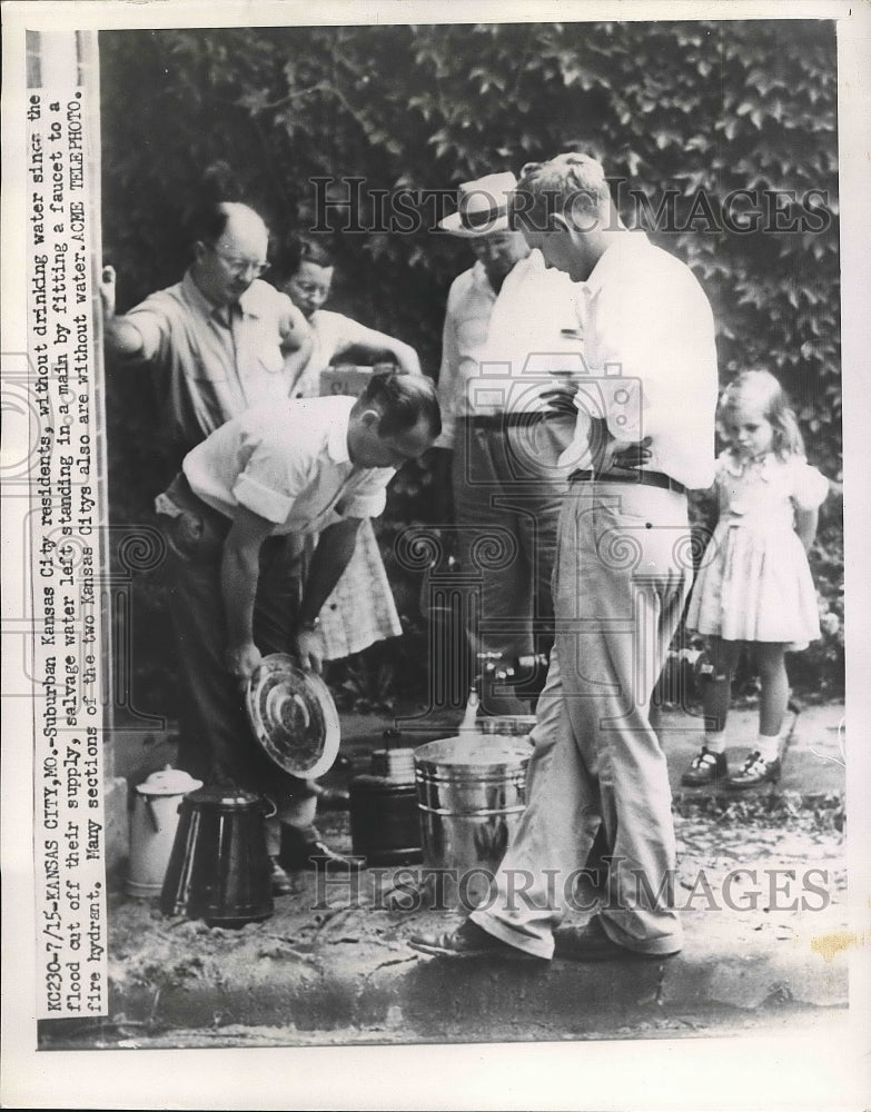 1951 Press Photo Family gather in water after being cut off by - nea71922 - Historic Images