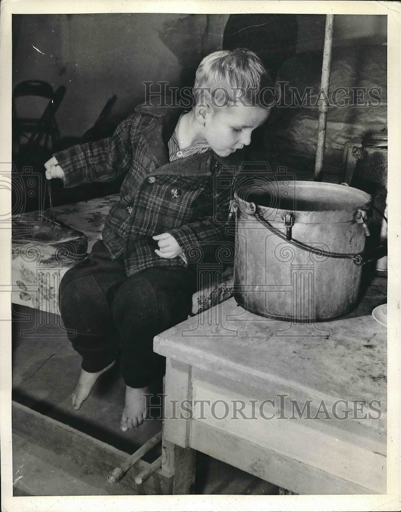 1941 Lawrence Baker sitting in the chair  - Historic Images