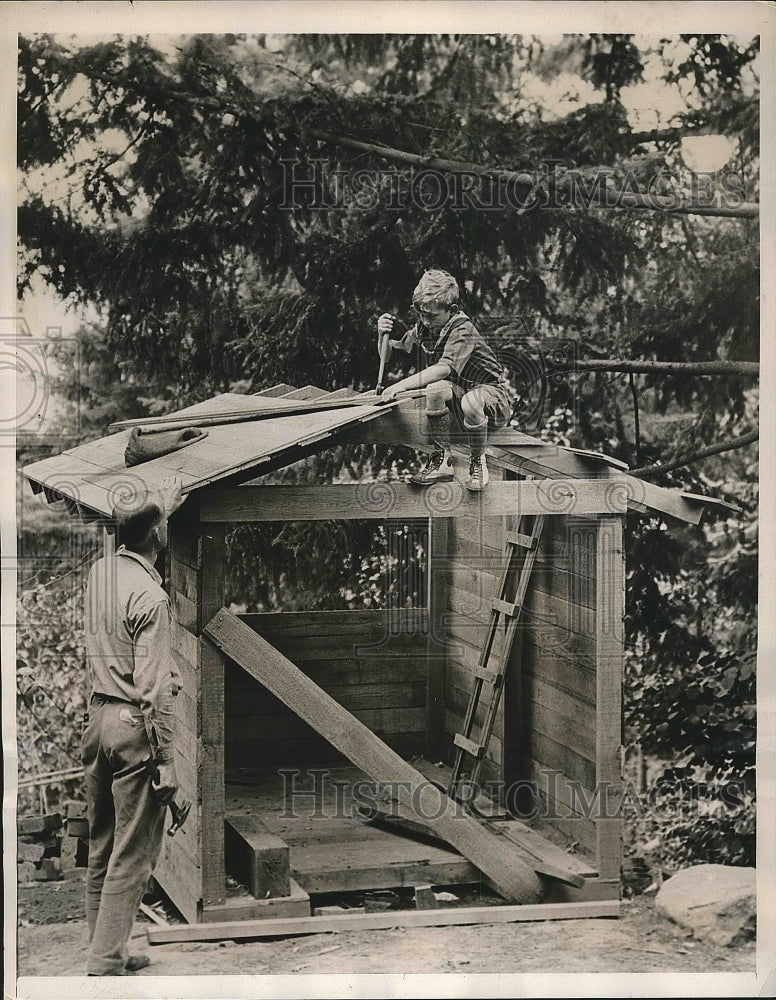 1940 A father and son building a playhouse  - Historic Images