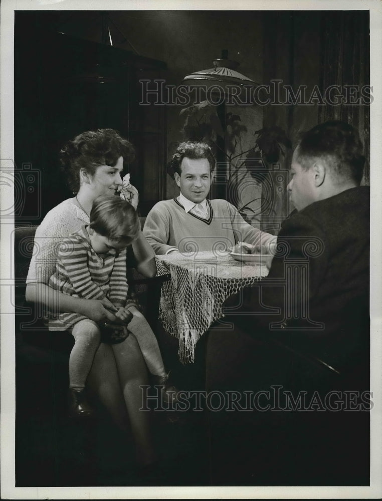 1952 Press Photo two mean a woman and young girl seated at table - nea72529 - Historic Images