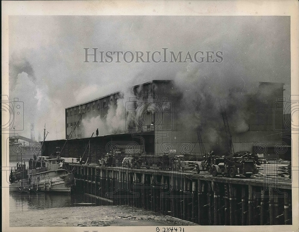 1946 Firefighters putting out a fire in Charlestown Massachusetts - Historic Images