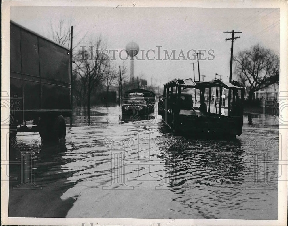 1951 Trucks Driving Through Flooded Street  - Historic Images
