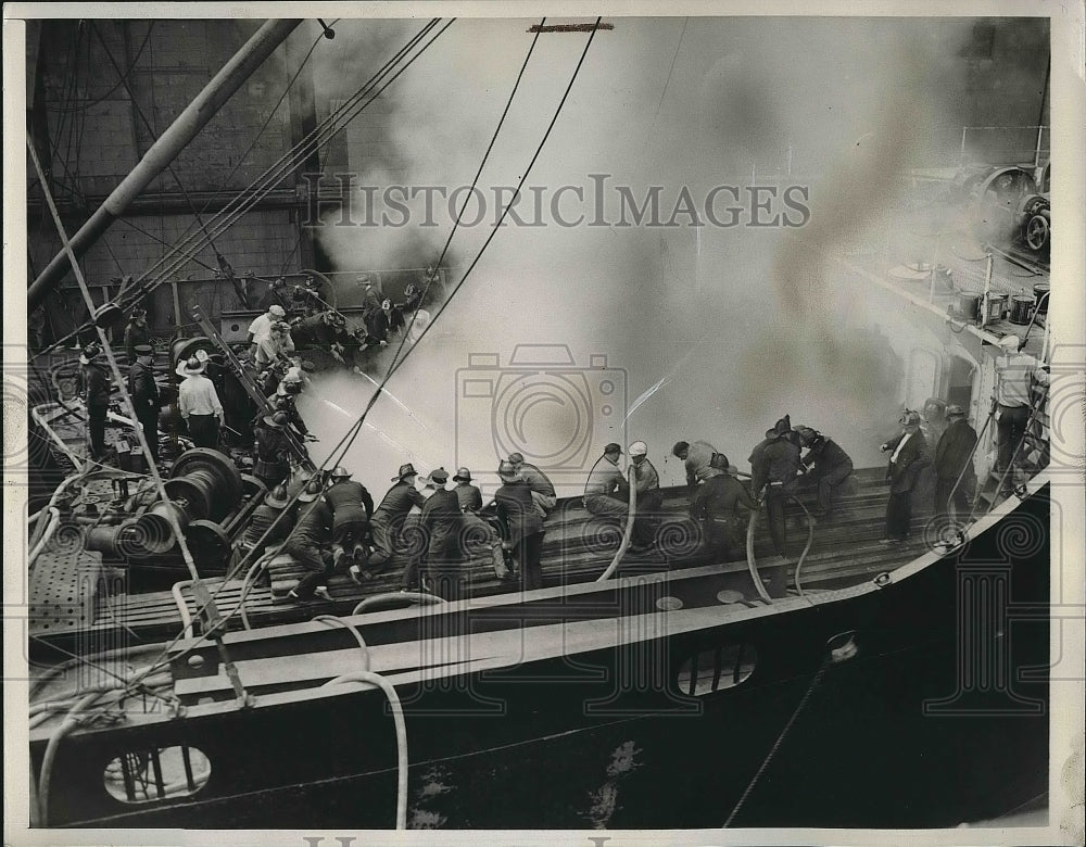 1939 Press Photo 130 Boston Firefighters Battle Fire Inside Ship&#39;s Hull - Historic Images