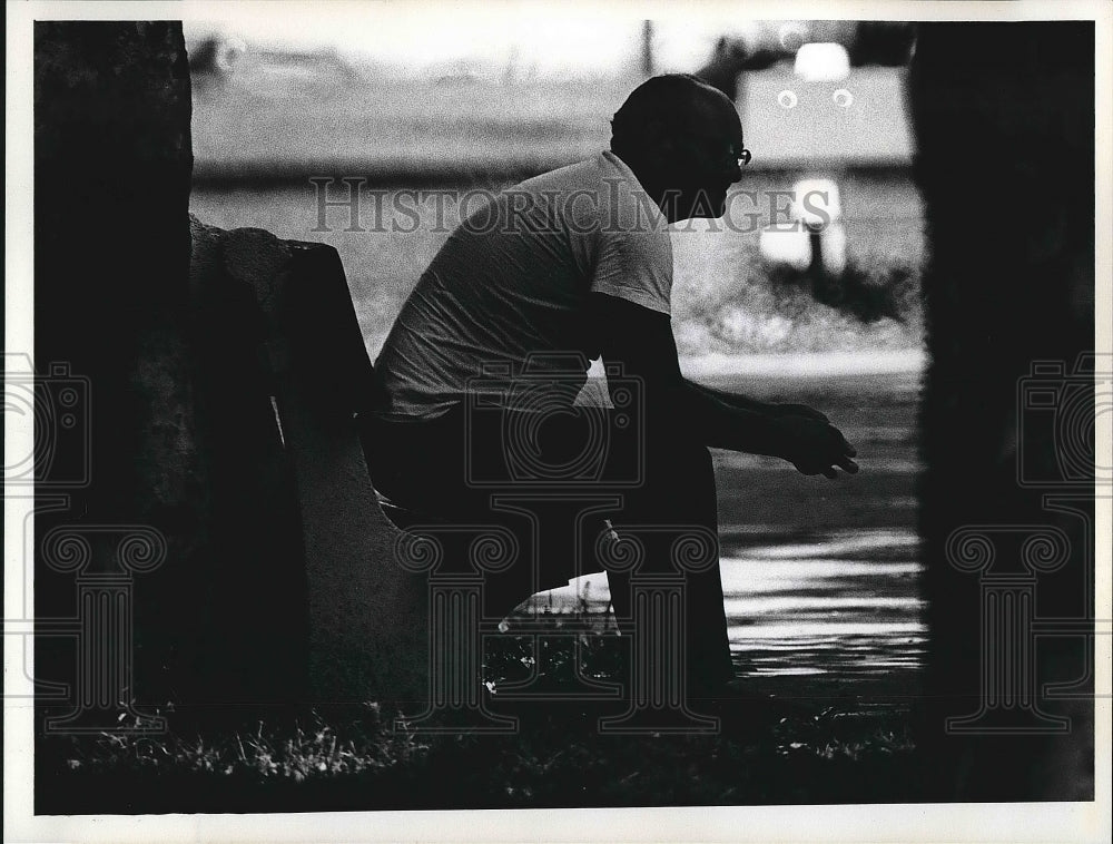 1973 Photograph of Man Seated on Park Bench by Larry Nighswander - Historic Images