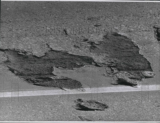 1970 Potholes And Cracked Pavement In Road  - Historic Images