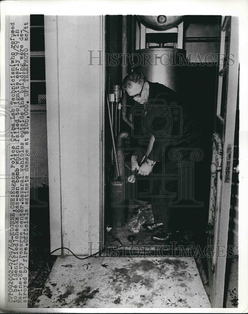 1968 Eugene, Ore, Police crime lab tech checks a gas can bomb - Historic Images