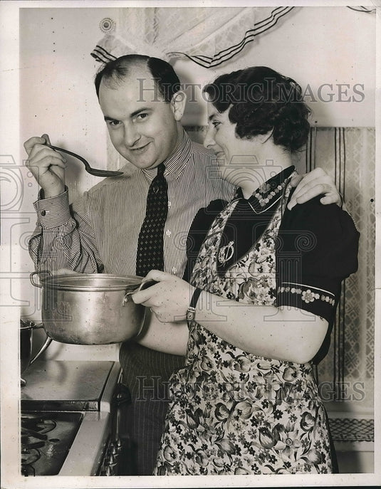 1938 Michael J. Quill Helps Wife Cook in Home on Weston  - Historic Images