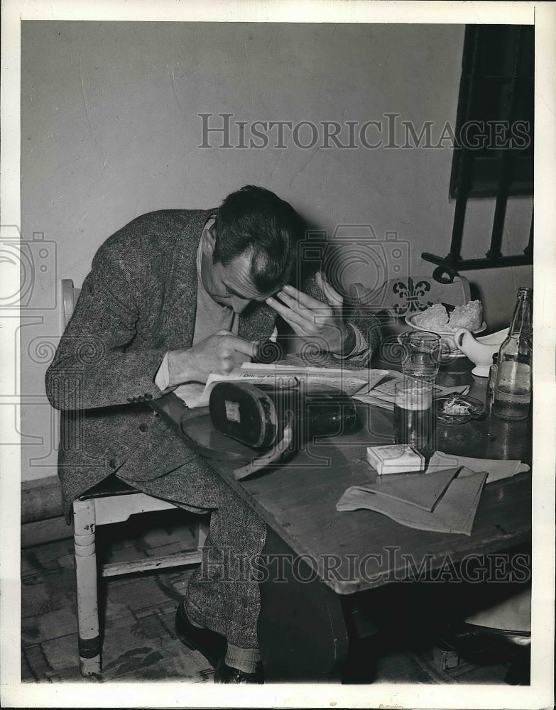 1945 Man Checking Statistics on Hipodromo&#39;s Race Track  - Historic Images