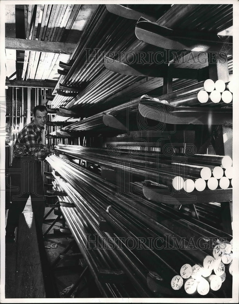 1961 Gleaming metal rods are motorboat propeller shafts  - Historic Images