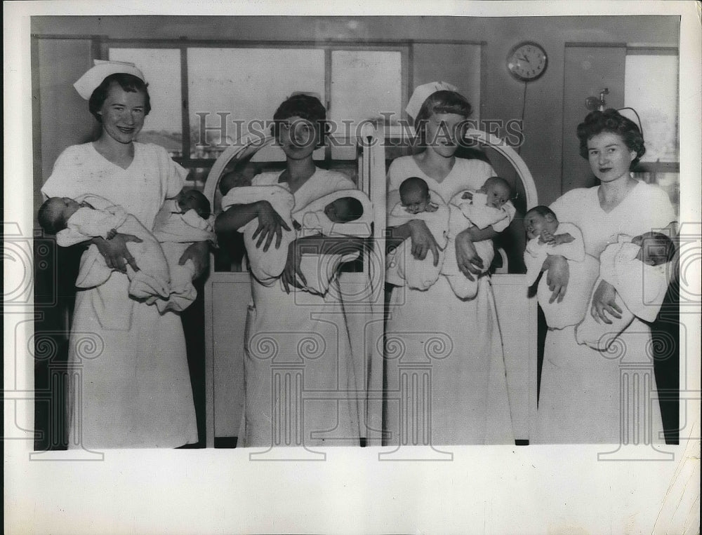 1961 Press Photo Nurses holding newborn twins - nea74140 - Historic Images