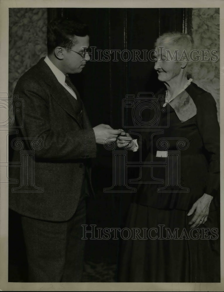 1934 Theodore Andrica gives medal to Mrs mary Clark  - Historic Images