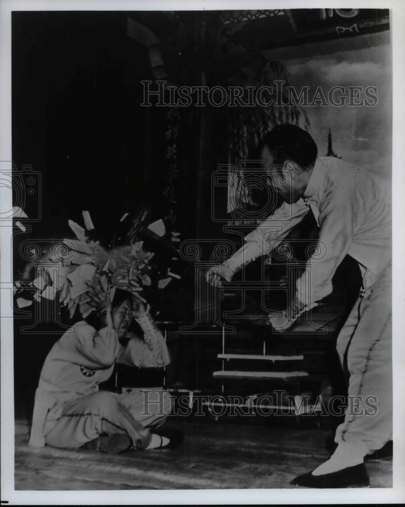 Press Photo Man smashed fruit with hammer over womans head - nea74425-Historic Images