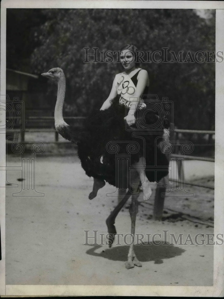 1932 Press Photo Marjorie Ernest on an ostrich at a Calif. farm - Historic Images