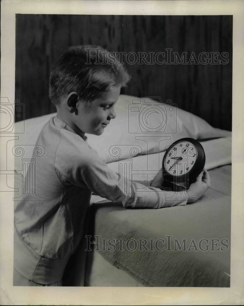 1953 Jock Macomber Sets His Clock Forward for Daylight Savings Time - Historic Images