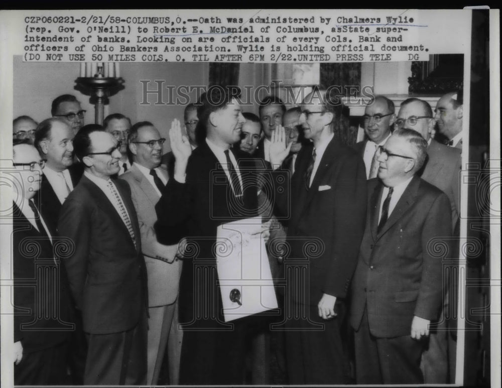 1958 Oath being administered by C. Wylie to Robert McDaniel - Historic Images