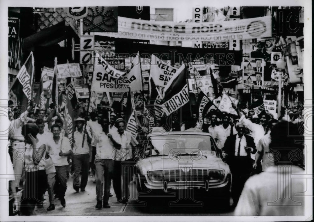 1968 Celebrators parading down the street for presidential election - Historic Images