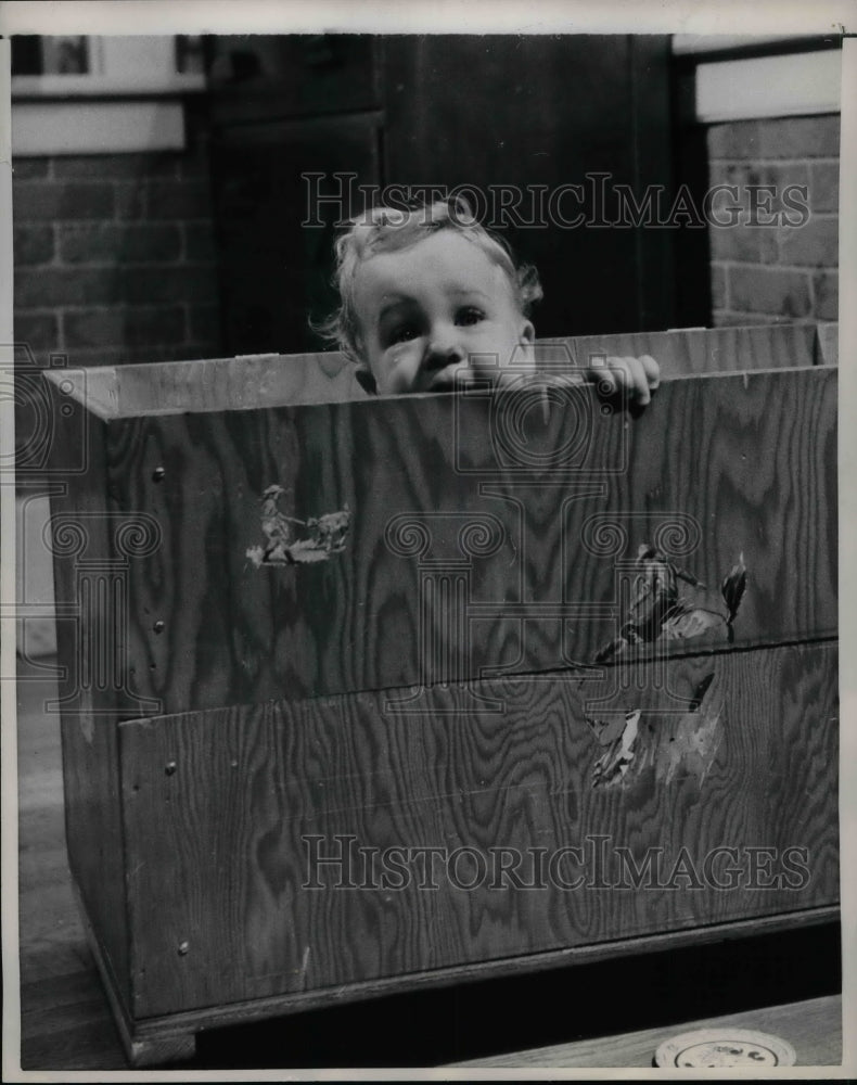 1957 Press Photo Topsy Turvy Fourth Of Five Children Keith Hiding in Box - Historic Images