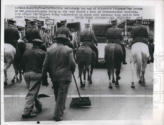 1959 Cleanup at the end of Atlanta's Veterans' Day Parade - Historic Images