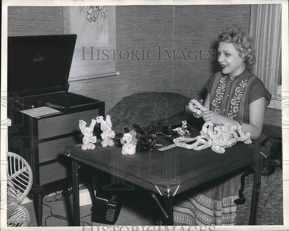 1957 Bevely Knecht makes paper animals at her home  - Historic Images