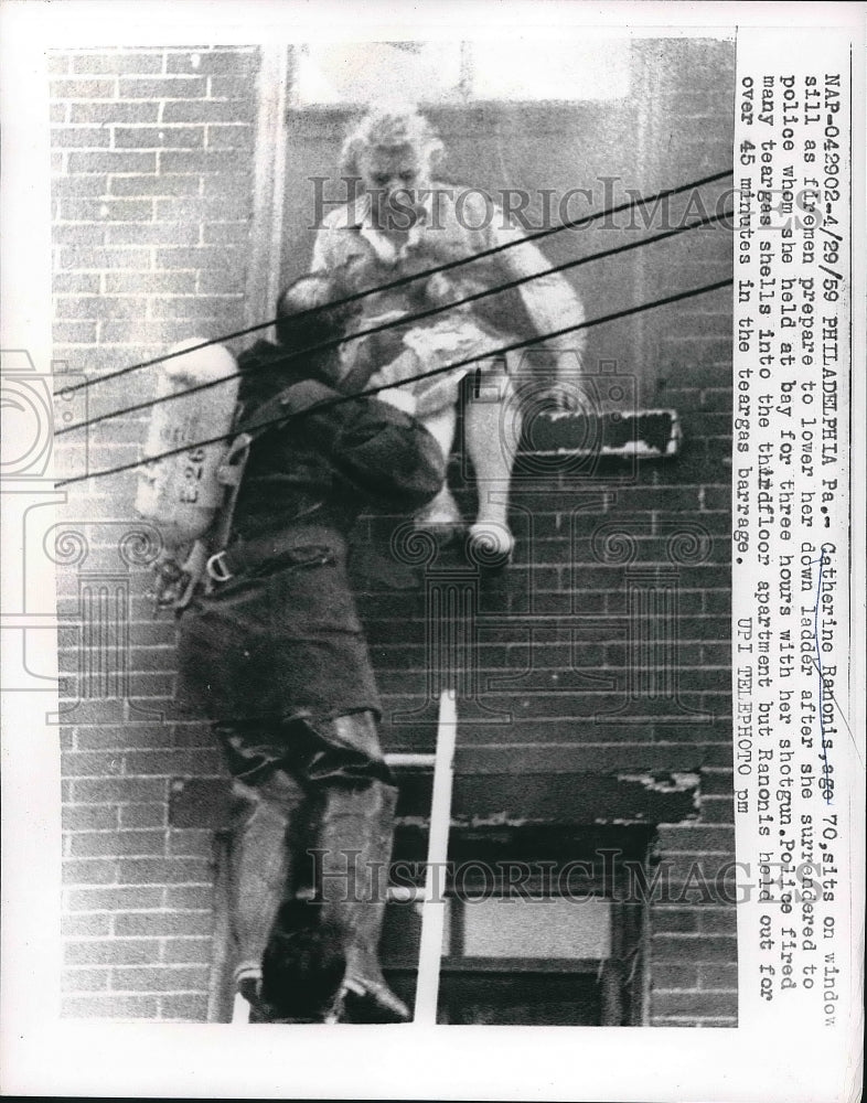 1959 Catherine Ranonis lowered at the ladder after she surrendered. - Historic Images