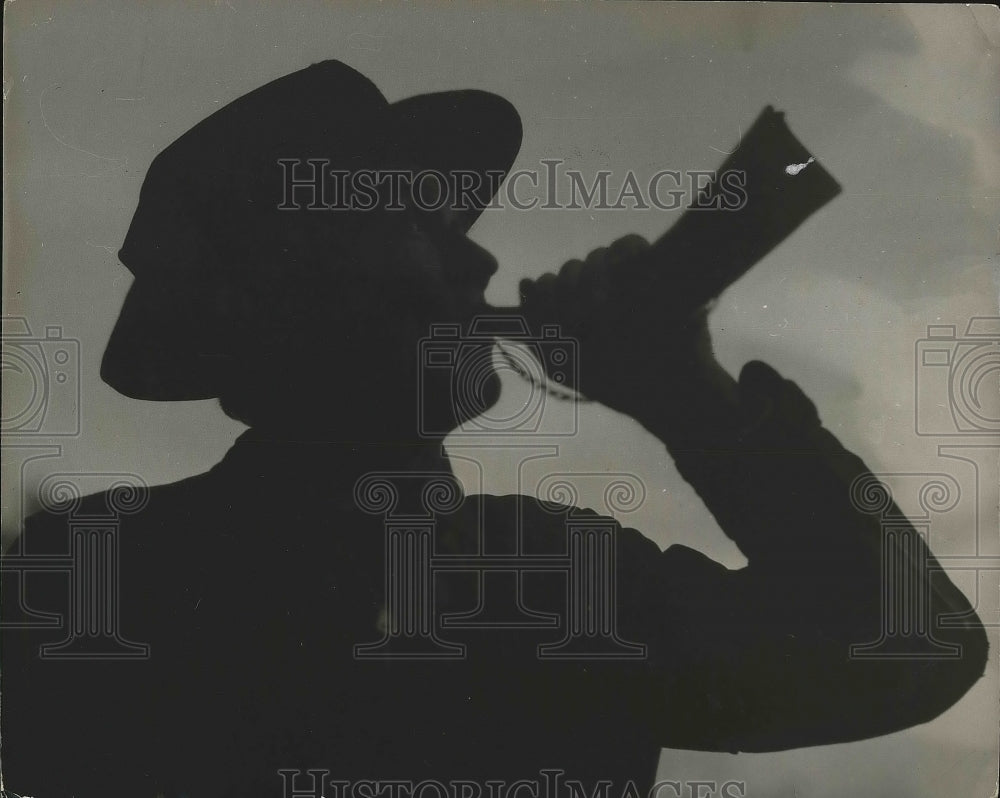 1944 Press Photo Silhouette of Hunter Using Steer Horn Call for Wild Boar Hunt - Historic Images