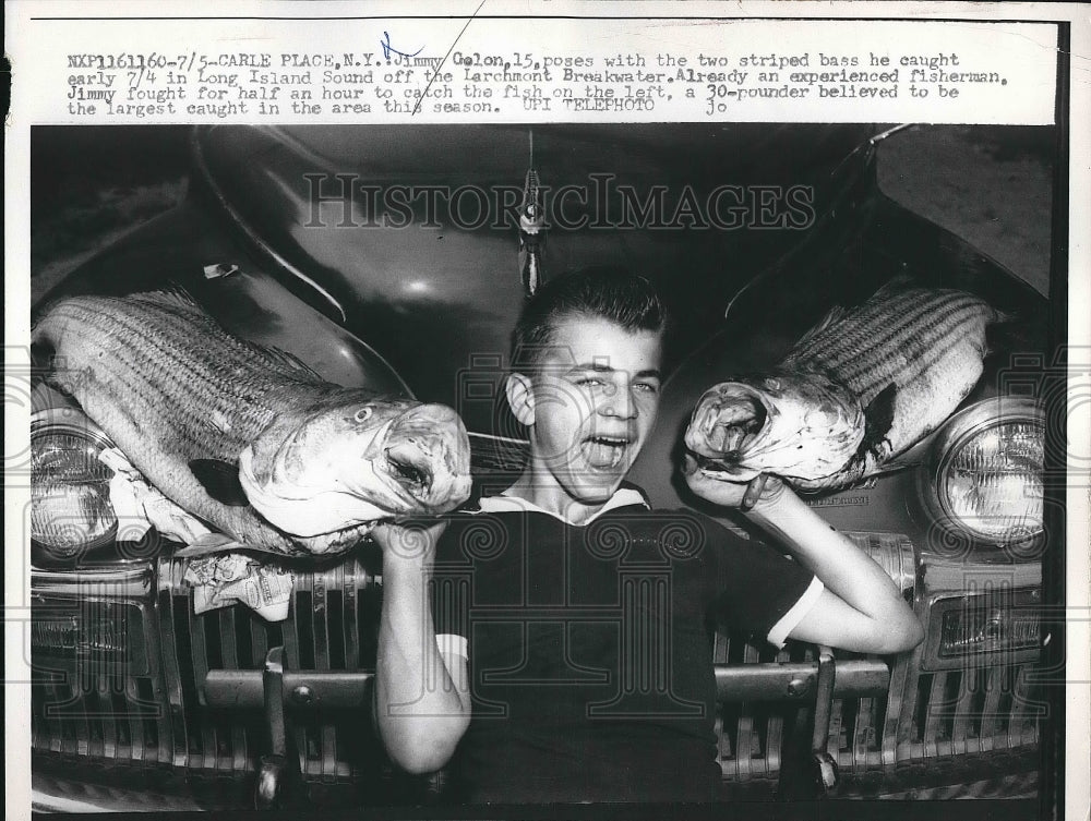 1958 Press Photo Jimmy Galon with striped bass he caught in Long Island Sound-Historic Images
